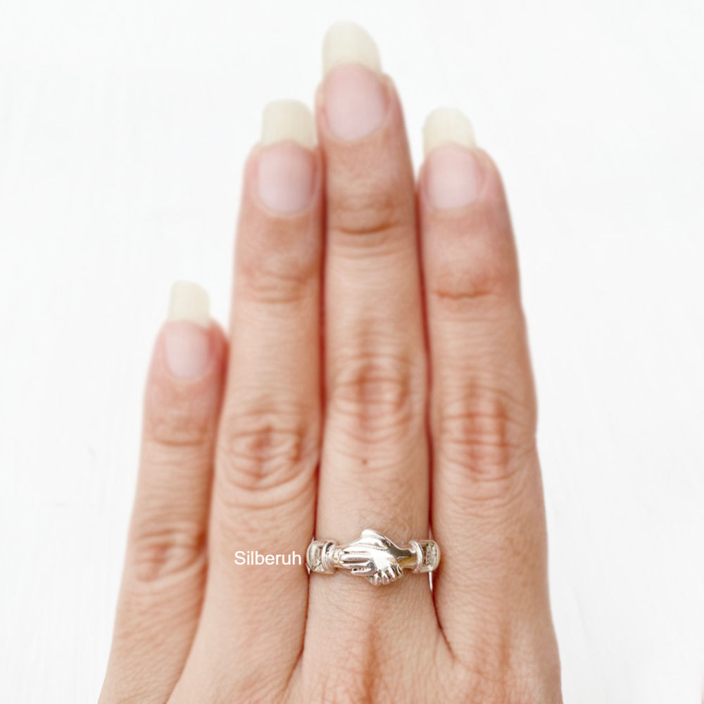Two Hands With Wedding Rings Stock Photo By ©belchonock